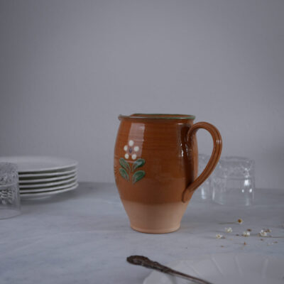 Brun Kande med Blomst